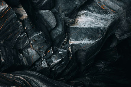 a pile of black plastic bags sitting next to each other_edited.jpg
