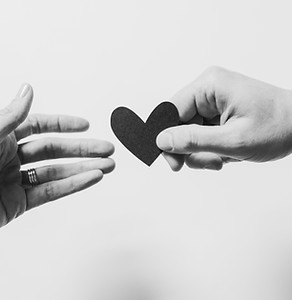 Man handing a woman a heart shape_edited