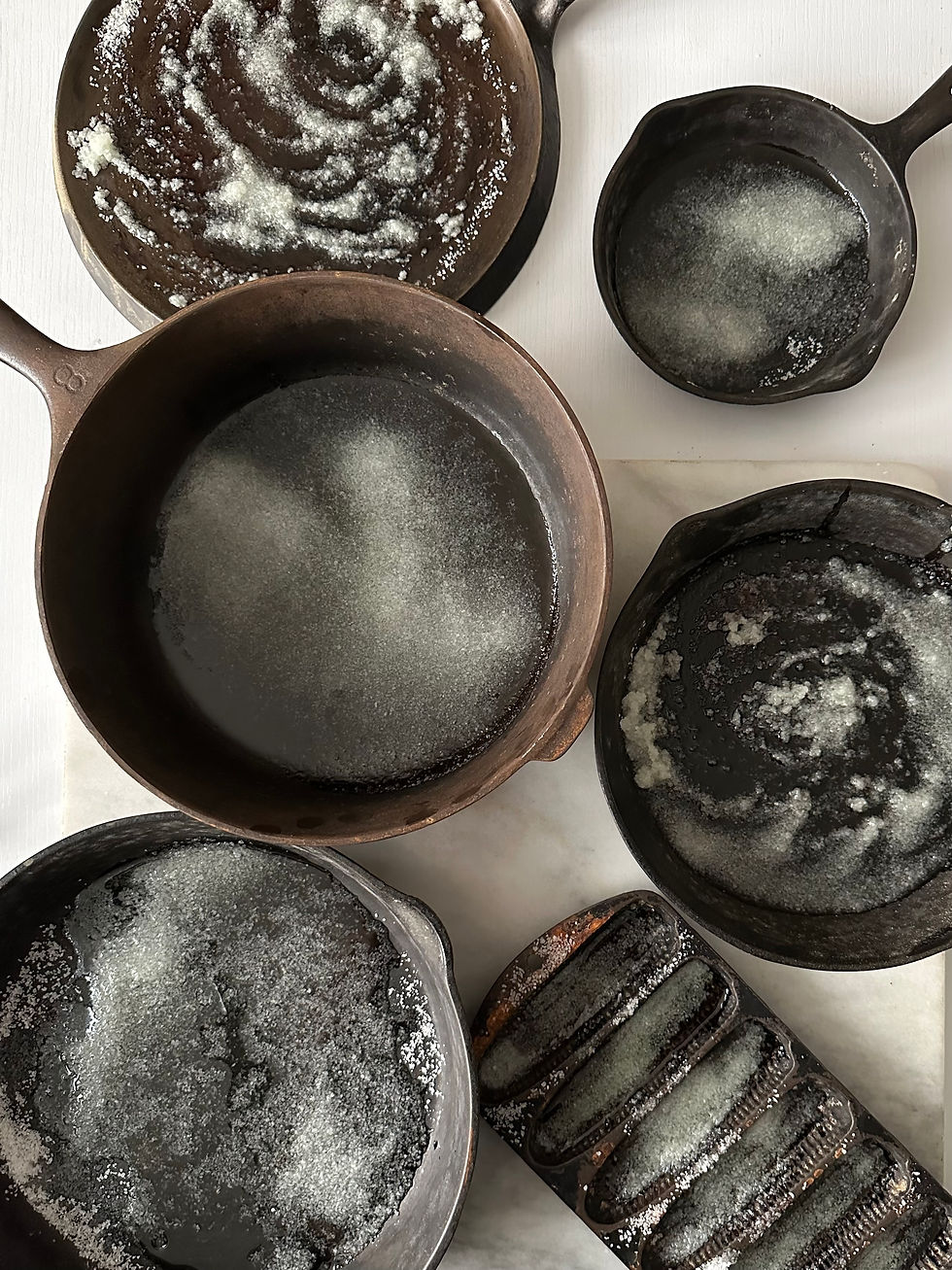 Cast iron skillets after baking in oven with salt and oil for cleaning prep