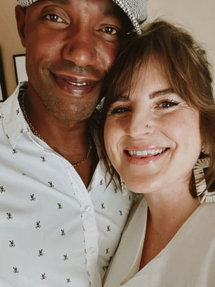 Kevin and Kate smiling close together, foreheads touching, in a warm candid moment.