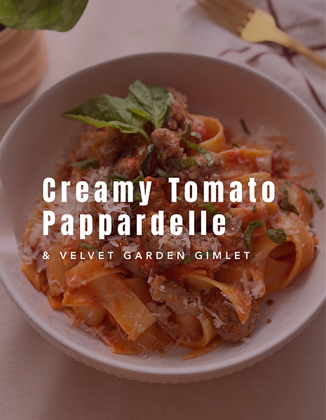 Creamy tomato pappardelle pasta with Italian sausage and fresh basil, served in a bowl with grated Parmesan