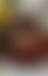 Strawberries mixed with pectin and lemon juice in a large white saucepan on the stove before boiling.