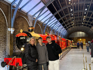 A family in front of the Hogwarts express