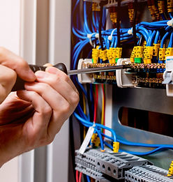 electrician installing a new electrical panel for improved safety and efficiency
