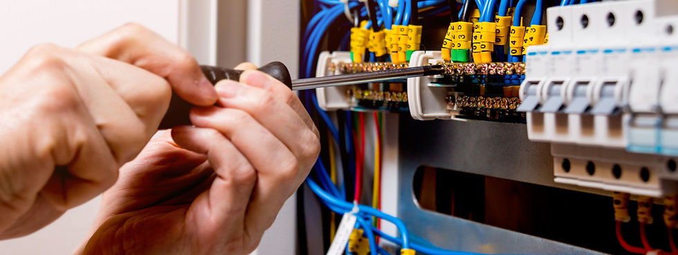 Electrician fixing a breaker