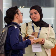 Attendees speaking during a break.