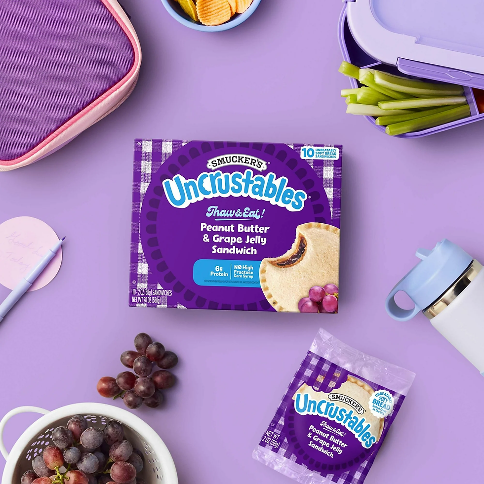 Air Fryer Smucker’s Uncrustables Peanut Butter & Grape Jelly Sandwich on a table
