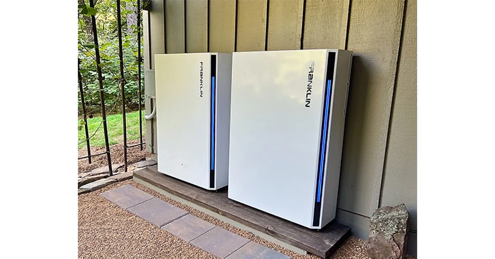 two whole home batteries in a garage