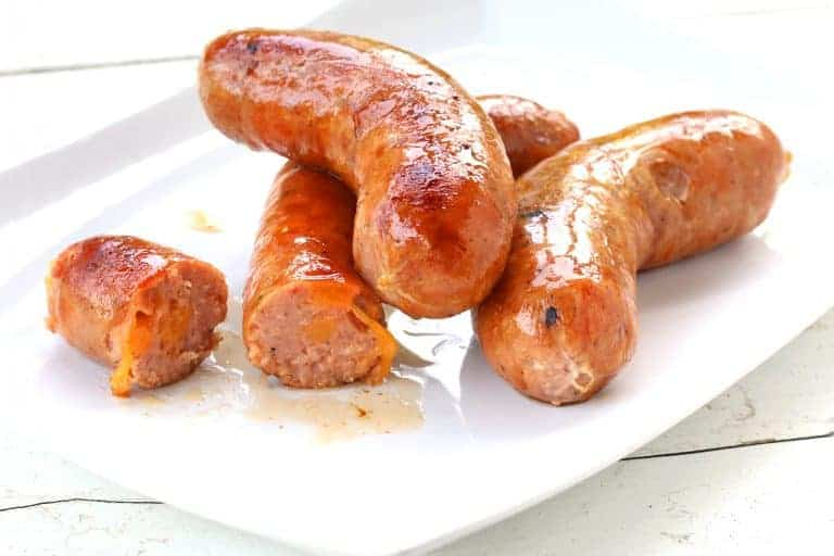 Air Fryer Johnsonville Double Cheddar Smoked Sausage up close on a plate