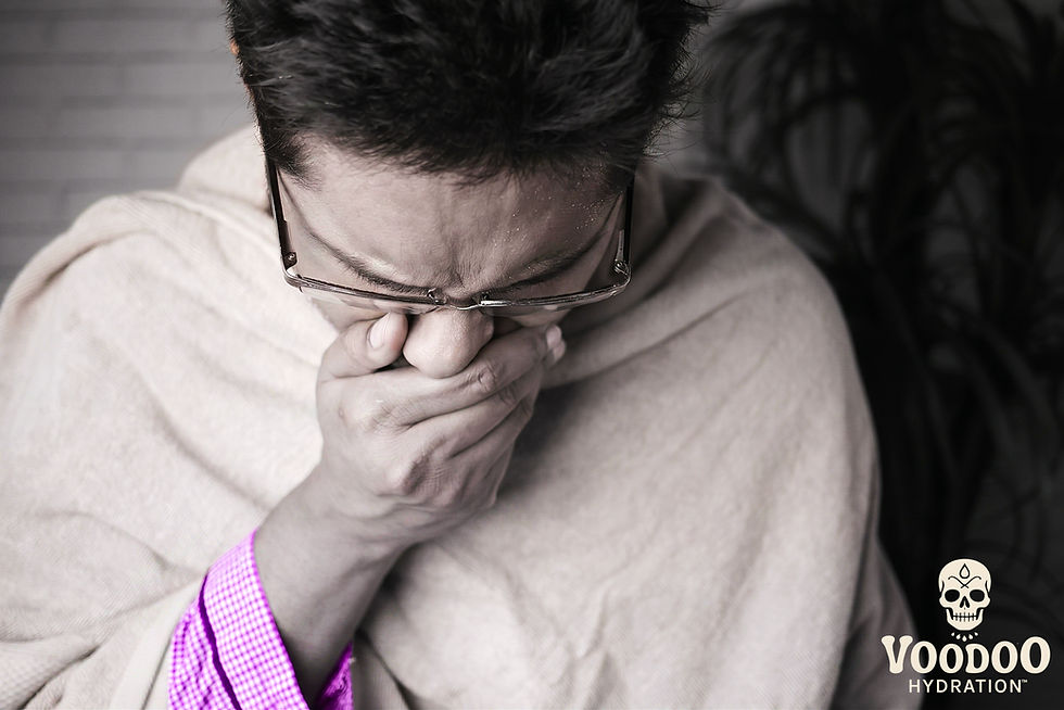 a man sick and coughing in his hand
