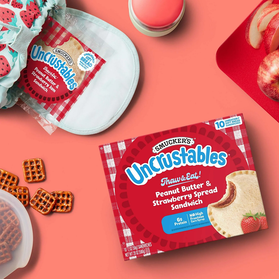 Air Fryer Smucker’s Uncrustables Peanut Butter & Strawberry Jam Sandwich on a table