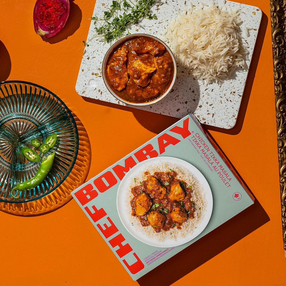 Air Fryer Chef Bombay Chicken Tikka Masala on a cutting board next to the box