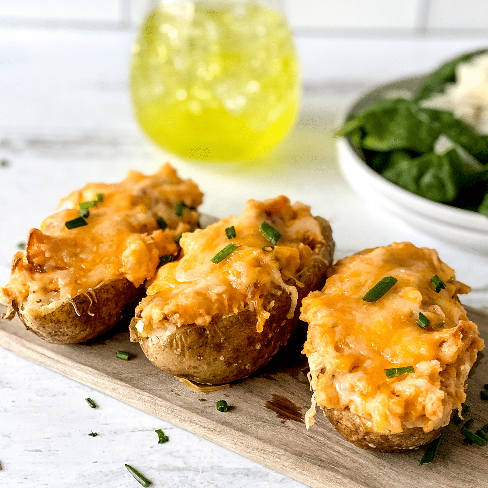 Cheesy Air Fryer Stuffed Potatoes: A Comfort Food Favorite on a cutting board