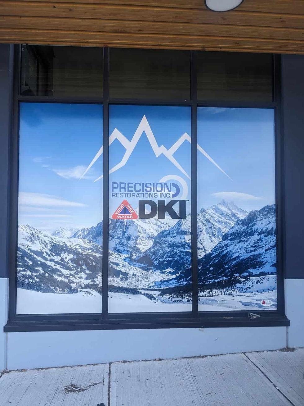 Custom printed graphics fully covering windows at DKI in Whistler BC