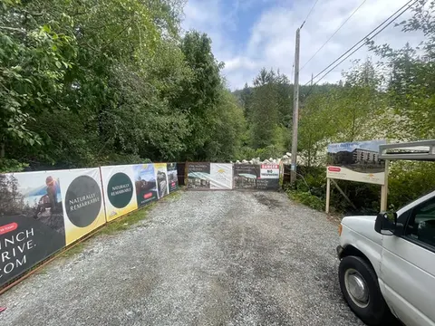 A bunch of custom printed fence banners installed at a construction site in Squamish