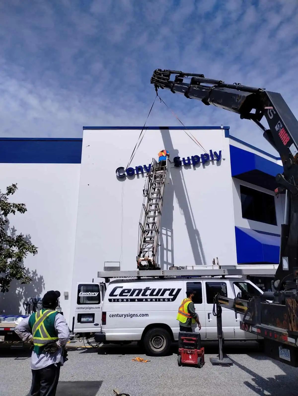 Century Signs installation team installing Raceway Channel Letters at Convoy Supply.webp