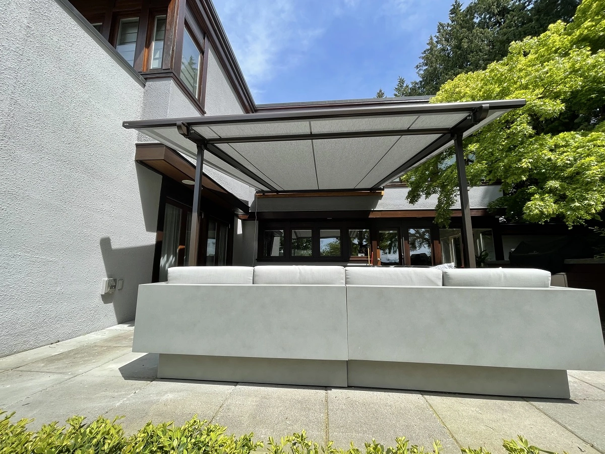 Residential outdoor retractable awning on the porch of a house.webp