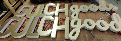 LED Edge Lit Dimensional Letters Displayed on top of a table