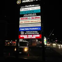 LED lit pylon sign showcasing business name at Marco Plaza in Chilliwack