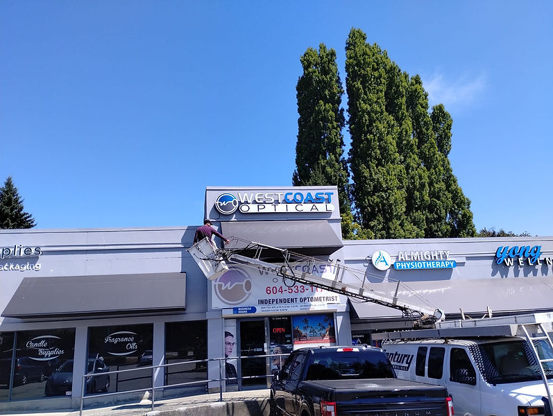 Century Signs Installing a Building Sign in Vancouver with a Bucket Truck