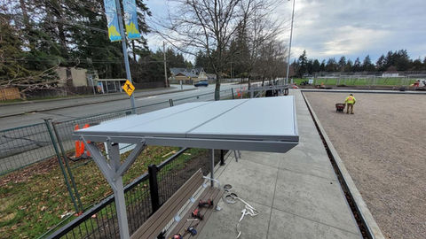 A closeup of a shaded bench at a lawn bowling playground