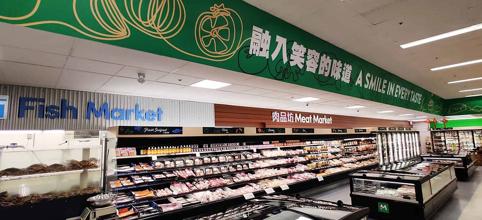 Various signs and graphics in the meat section of Meiga Supermarket