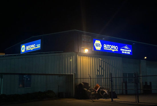 2 Illuminated Nappa Autopro Lightbox Signs illuminated at night.jpg