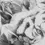 Thumbnail: Graphite pencil drawing by Yana Evans of a fierce tiger with piercing eyes surrounded by bamboo leaves in fine detailed shade
