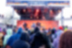 DJs performing on the SAWDUST stage for a large crowd.