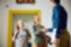 Parent and teacher shaking hands in support of student