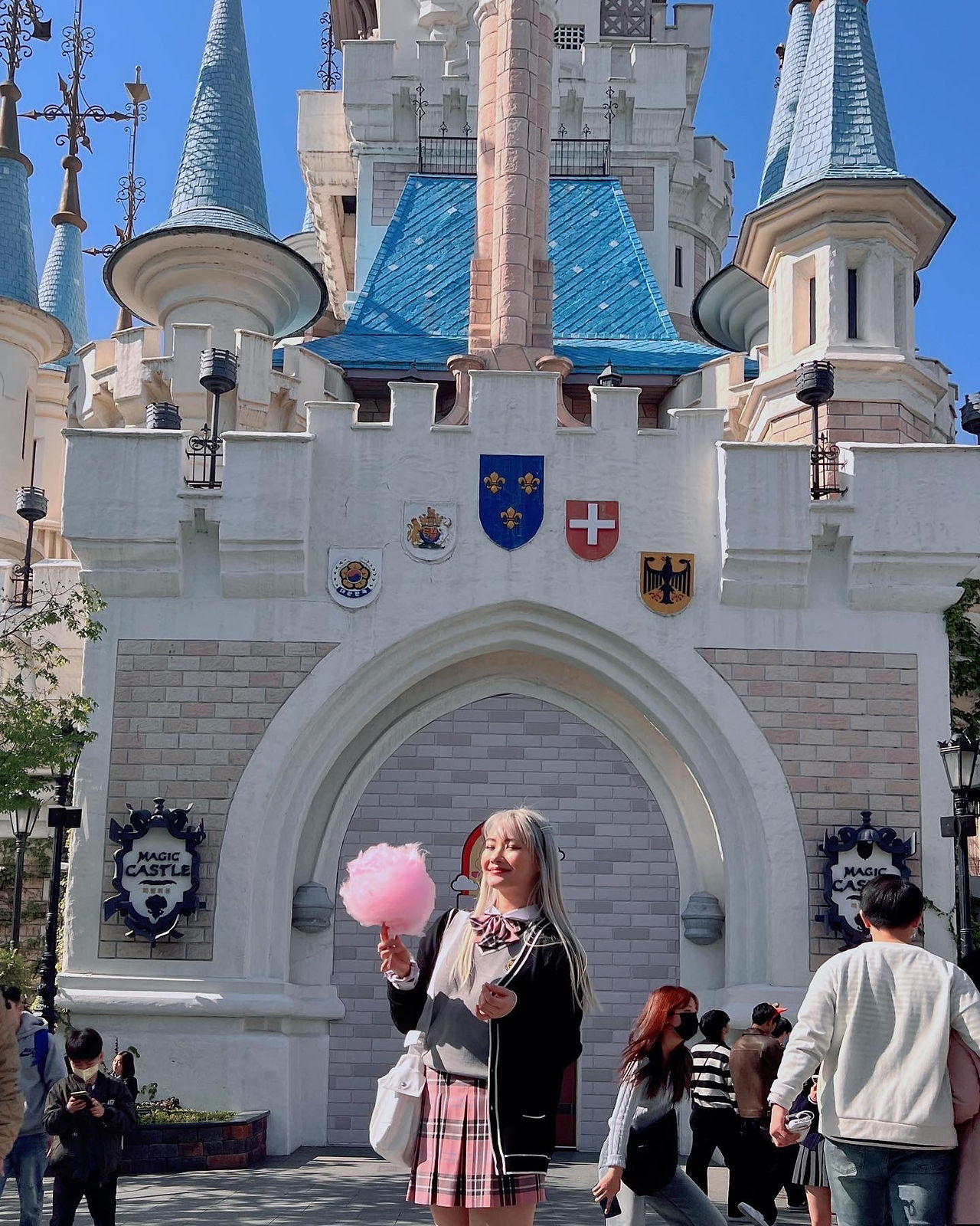 girl with cotton candy in front of lotte world castle seoul