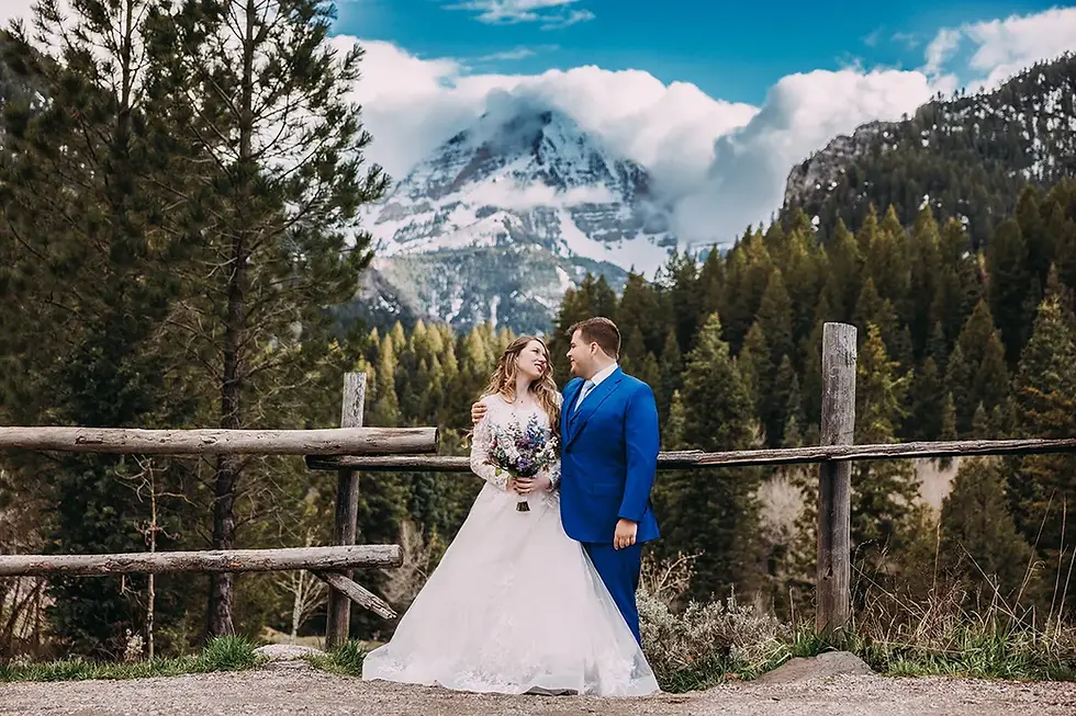 Bride and groom at Tibble Fork Reservoir in Spring with pine trees | Utah Wedding Photographer