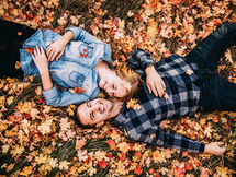 Couple in fall leaves