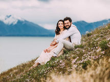 Couple sitting on a hill at Miners Canyon