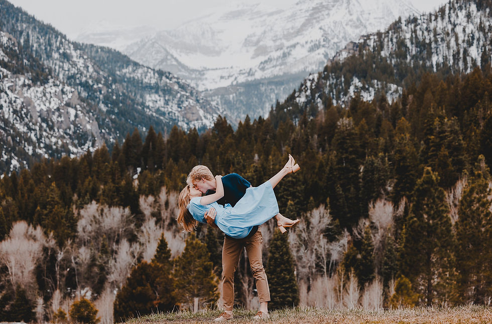 Engaged couple kissing at Tibble For Reservoir
