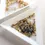 Thumbnail: White triangular dish containing beads