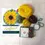 Thumbnail: The kits box showing a sunflower next to the wools and templates included in the kit