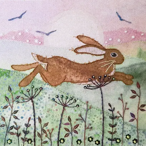 Embroidered scene featuring a Hare leaping over various florals.