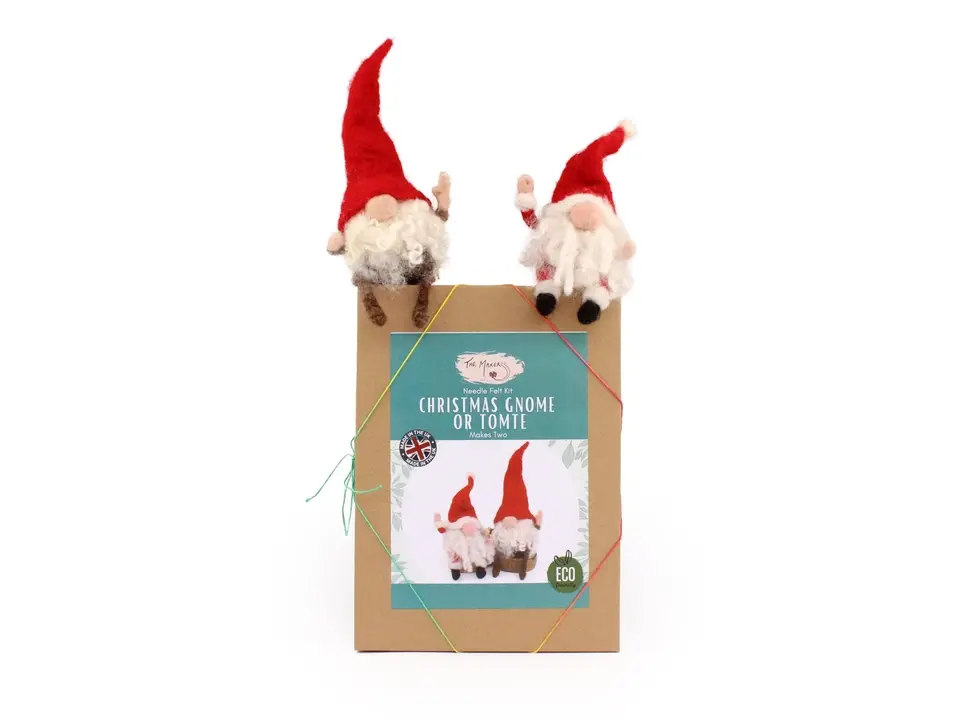 Brown craft box with label on front and two gnomes sitting on the top of the box