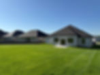 Mature residential lawn surrounding a newly constructed home