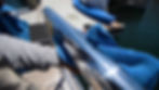 Polishing stainless steel boat railing during marine detailing