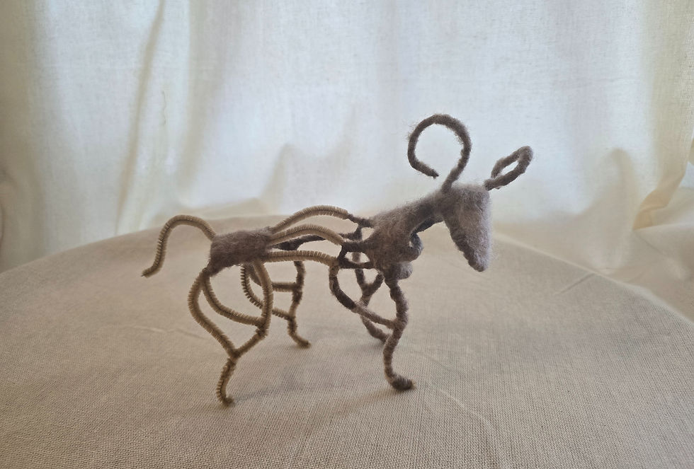 I call this creature the "deer". it is made of pipe-cleaners and wool.