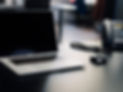 Apple MacBook Pro 15_ with black screen on a black desk._edited.jpg