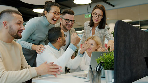 Multi-ethnic team women and men are talking clapping hands doing high-five celebrating ach