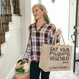 nutritionist with basket and bag of groceries