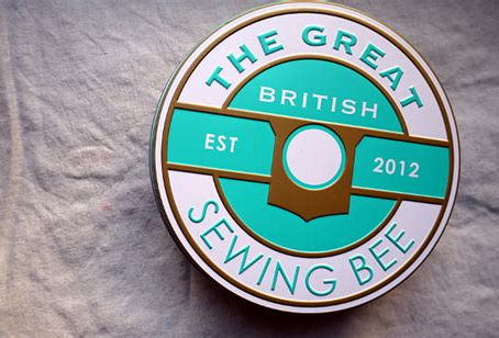 Great British Sewing Bee Badge on a fabric background