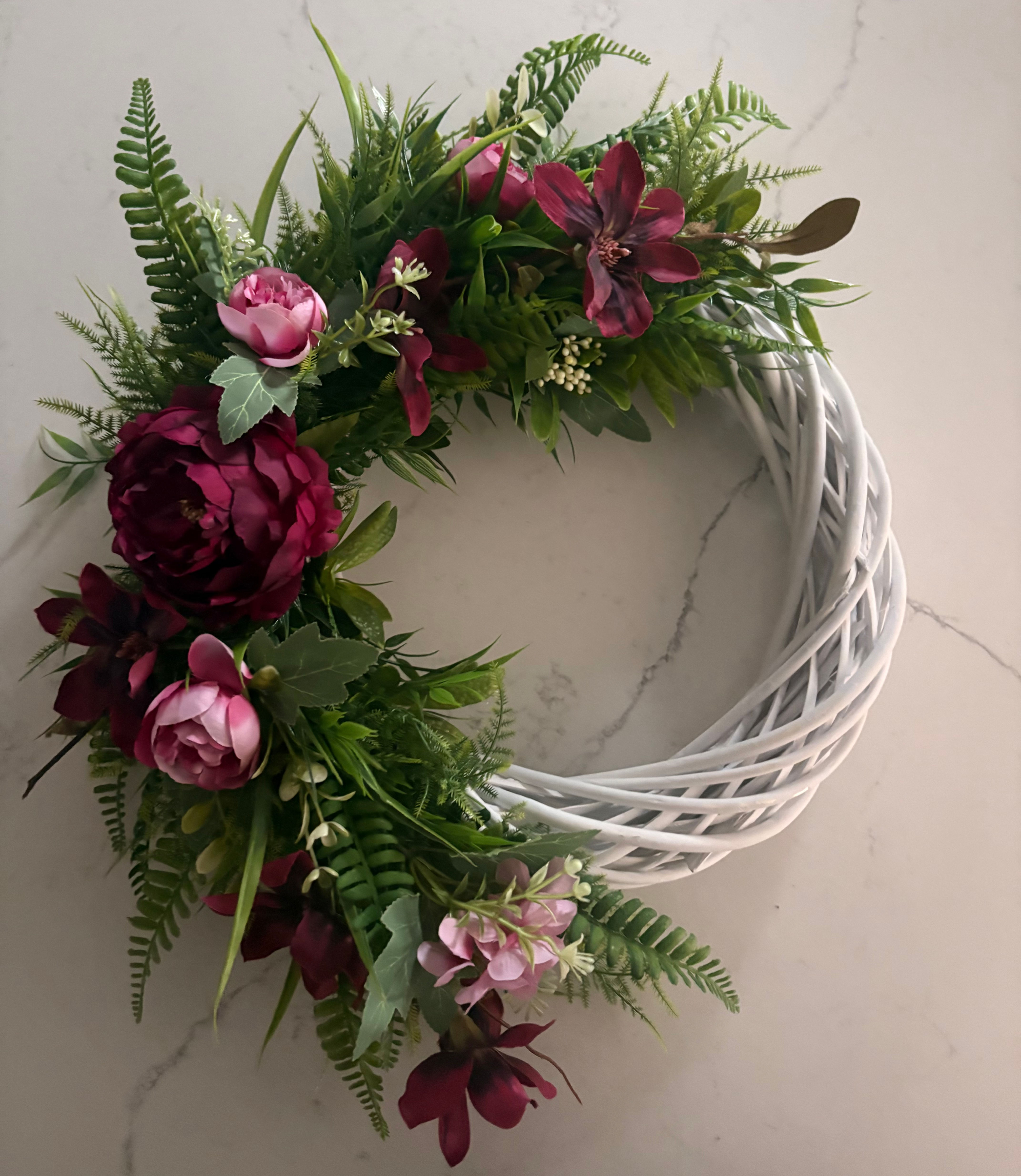 Artificial wicker door wreath