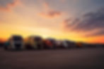 many-transport-trucks-parked-service-station-sunset-ai-generative.jpg