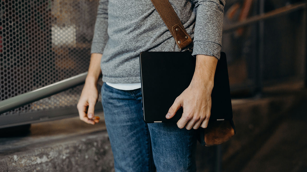 Man Holding Laptop indecent images devices