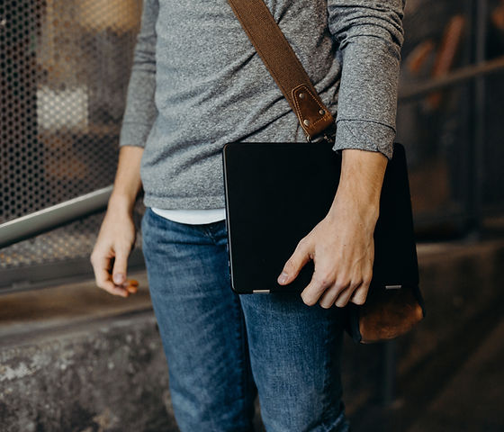 Man Holding Laptop